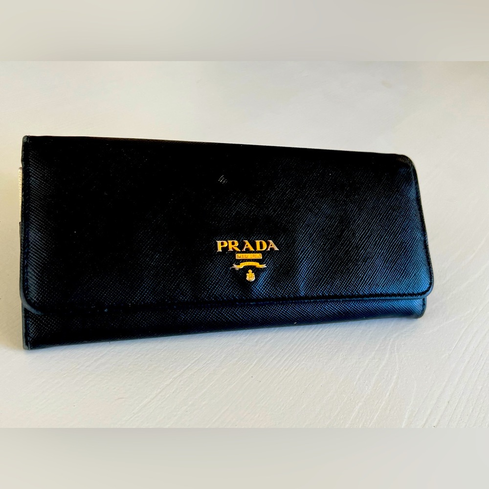 PRADA black saffiano leather wallet w/ red interior